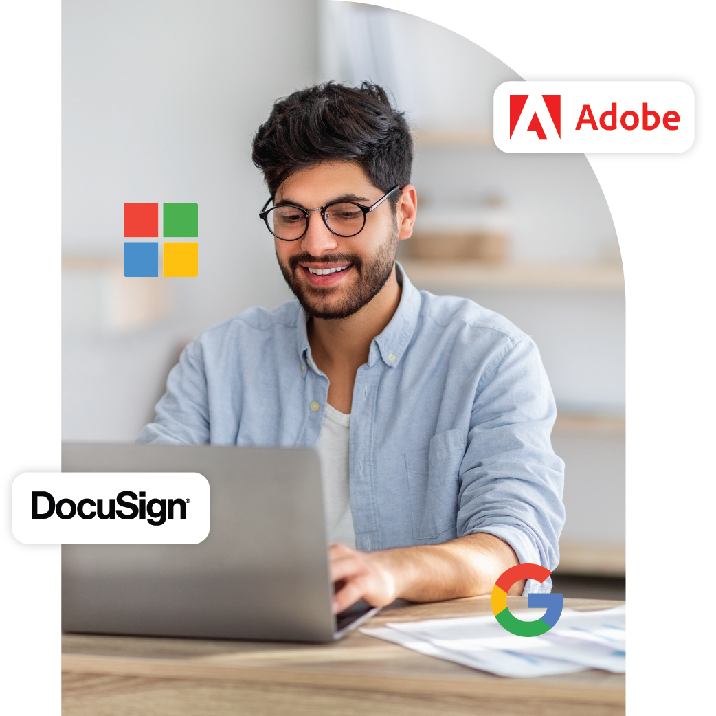 Cloud Licensing Review Main Image. Employee behind laptop with Adobe, Microsoft, Google and Docusign floating logos around him